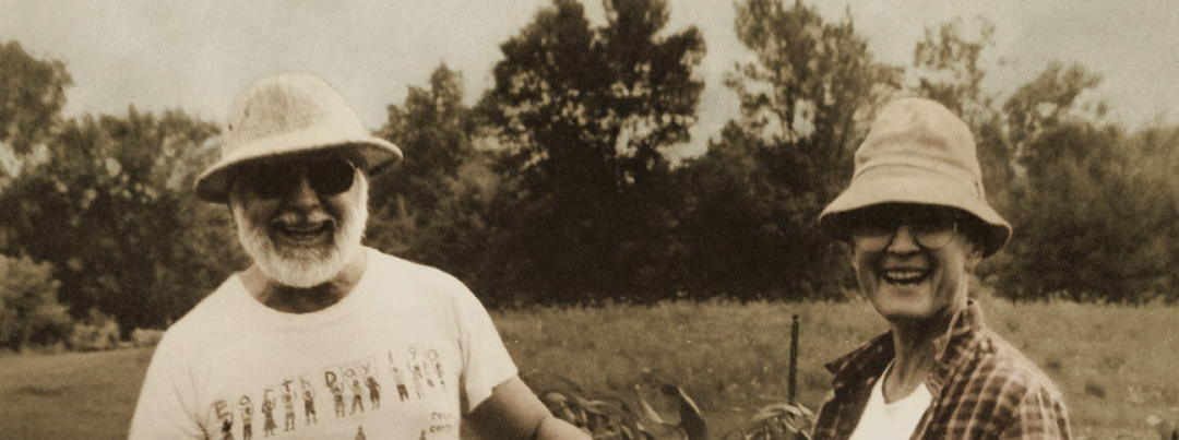Historical image of Betsy and Gunter smiling on their farm
